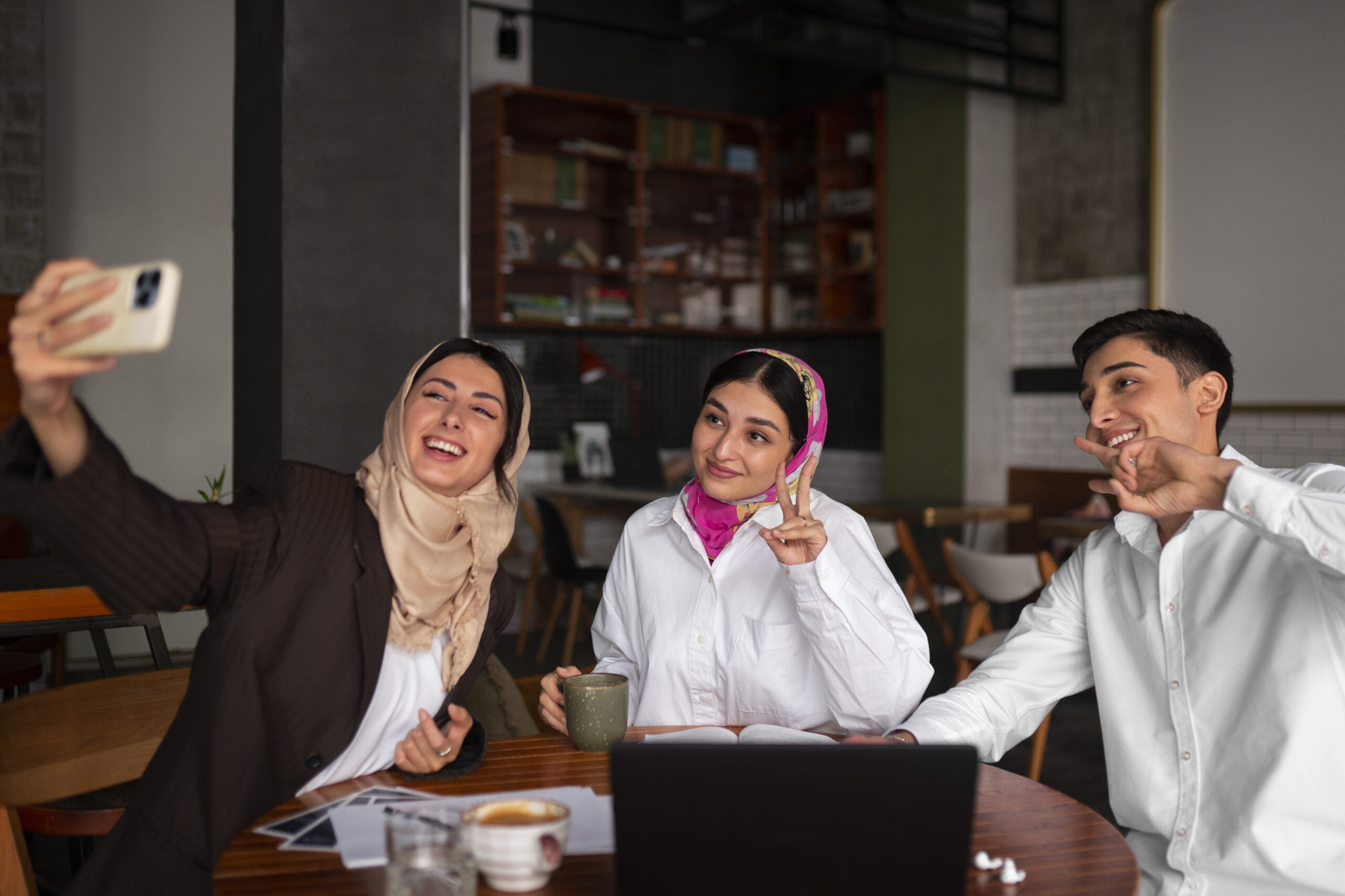 medium-shot-arab-friends-taking-selfie
